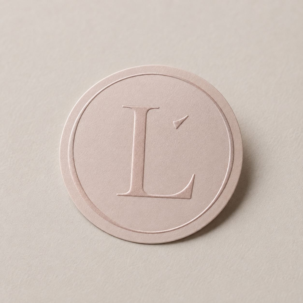 The Leocé L pressed into a blush seal